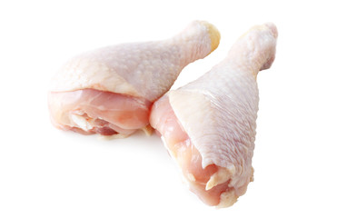 raw chicken legs over white