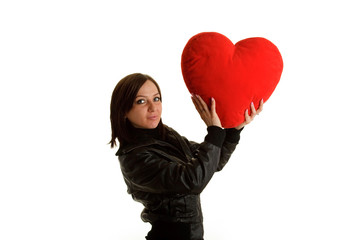 Girl with big red heart pillow