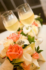 wedding rings and bouquet