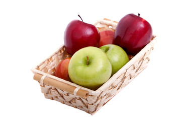 Colorful apples in wicker basket