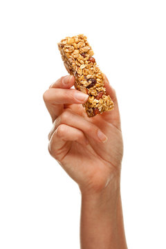 Woman Holding Granola Bar On White