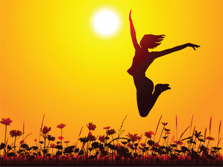 Silhouette of a young girl jumping on the meadow