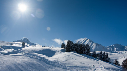 Winter sun in mountains