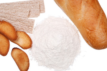 Bread, rusk and handful of flour on white