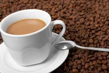 Cup with coffee, costing on coffee grain
