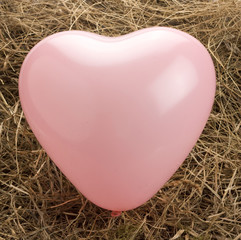 valentine heart balloon in haystack