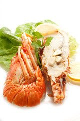 cutted lobster with lettuce and lemon