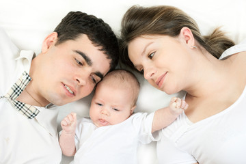 happy family - mother, father and baby