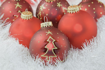 red baubles in white garland