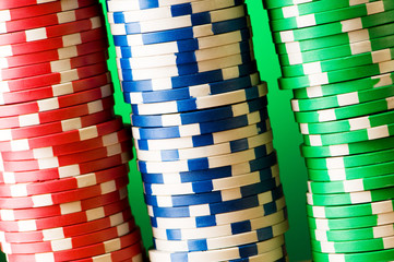 Stack of casino chips against gradient background