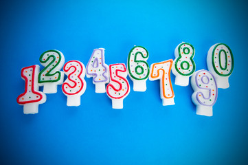 Birthday candles against colourful background
