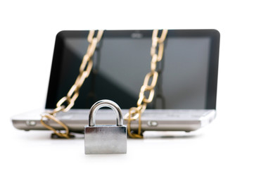 Concept of computer security with laptop and chain