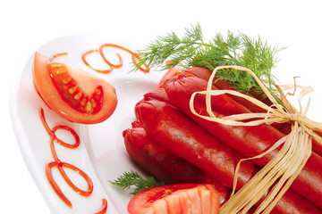 fresh smoked sausages on plate