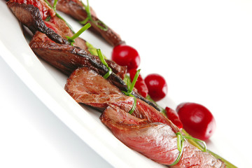 meat slices on white dish