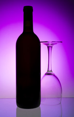 Red wine glass and a bottle