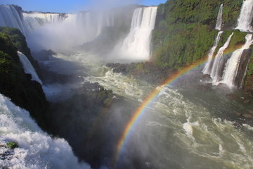 Iguazu waterfalls with rainbow on a sunny day. - 21213192