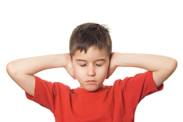 Boy blocking his ears