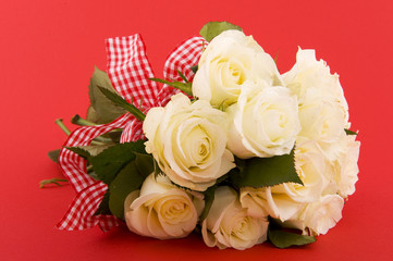 White roses on red