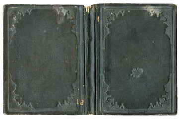 Old open book cover in leather with abstract and flourish embossed decorations - circa 1880 - isolated on white