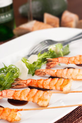 delicatessen dish with prawns on skewer