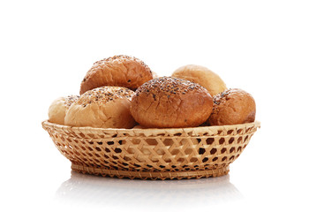 Buns with sesame in a woven basket