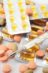 Heap of pills and thermometer