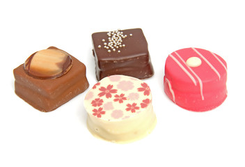 Delicious petit four over white background