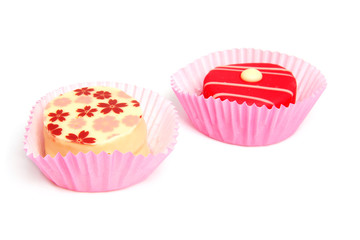 Delicious petit four over white background