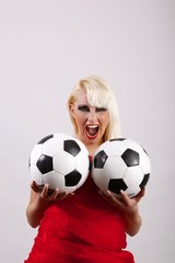 Fototapeta premium female crying football fan with two balls