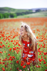 Girl in poppy field