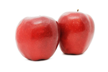 Two red apples isolated on white background