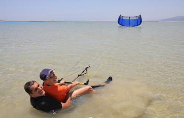 Kitesurfing. Father and son.