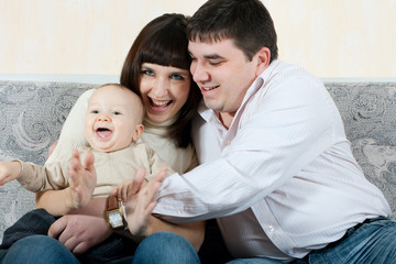 happy family - father, mother and baby