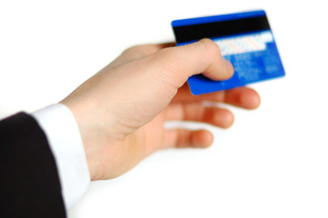 Man's hand holding out a credit card..