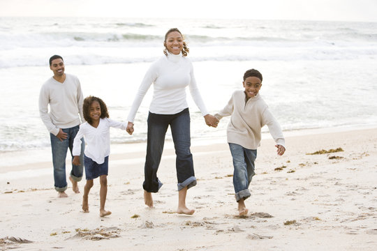 African-American family walking on beach