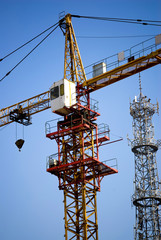 Naklejka premium Tower Crane under blue sky - Modern construction