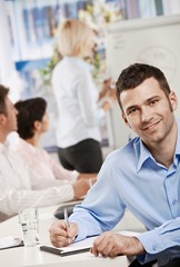 Businessman making notes on meeting