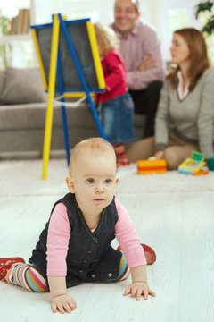 Baby crawling in living room