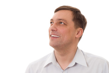 positive man in a blue shirt standing on a white background