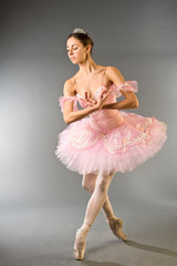 Graceful ballerina dancing isolated