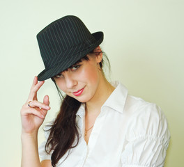 Young woman wearing black hat