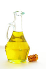 olive oil in a glass container, with cork