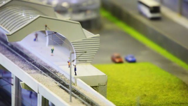 in modern toy city train goes by rail from station