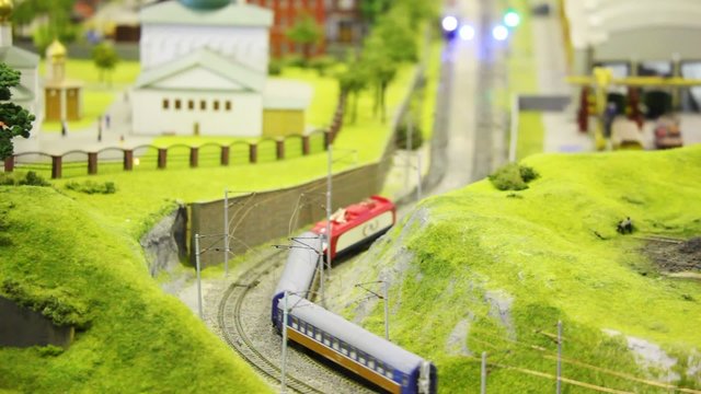 in small model city trian goes on meeting each other