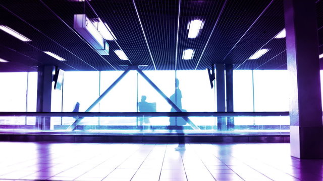 People silhouettes at the airport building.