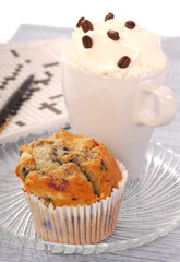 Blueberry muffin and a latte coffee
