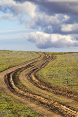 country road with mud, ruts