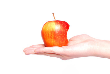 Bitten apple on woman hand