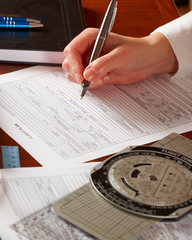 Airplane pilot filling in flight plan