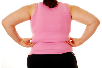 Overweight woman pinching her back fat